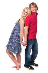 Young couple holding hands and smiling