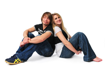 Fototapeta na wymiar Young couple siting on the floor and smiling