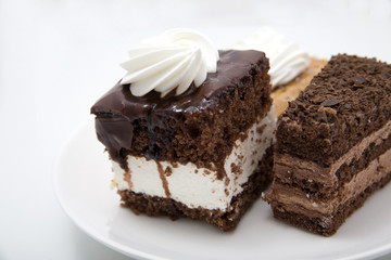Two chocolate cakes on white background