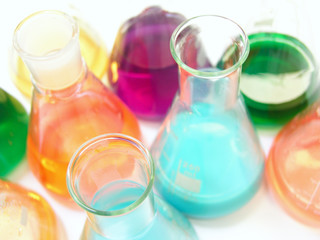 Laboratory glass with colorful chemicals