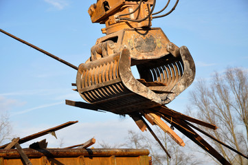 Demolition machine in action