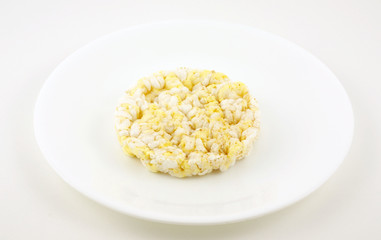 Rice cake on a white plate ready to eat.