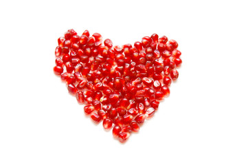 Fototapeta na wymiar Seeds pomegranate as heart sign