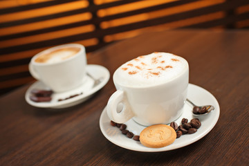 Two cups of coffee (shallow DOF)