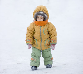 Fototapeta na wymiar Little girl on winter background