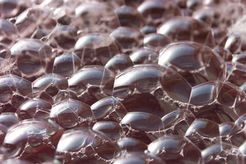 Soap bubbles on water in sunligth