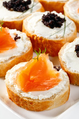 Mini sandwiches - bagel with cream cheese,  salmon, caviar