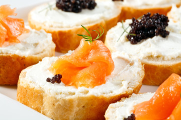 Mini sandwiches - bagel with cream cheese,  salmon, caviar
