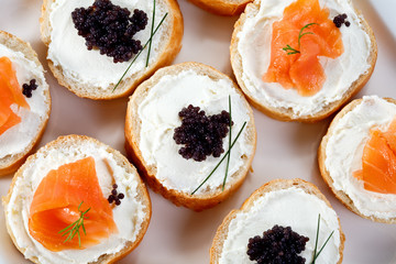 Mini sandwiches - bagel with cream cheese,  salmon, caviar