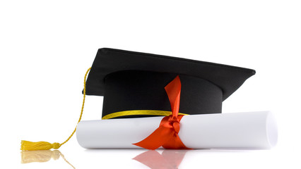 graduation cap and diploma with red ribbon isolated on white