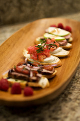 Bruchetta Appetizers on Wood Platter