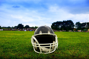 American football helmet in grass