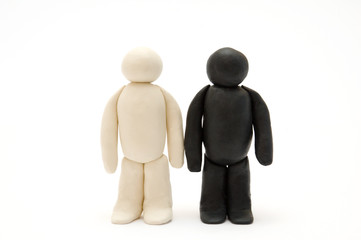 Two Plasticine men. standing isolated on white background