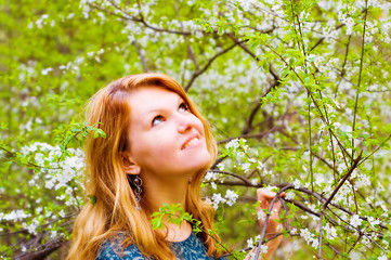 Young  woman and blossomed tree