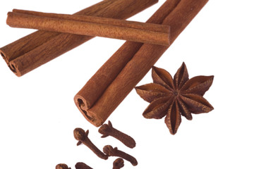 cinnamon, anise and cloves isolated on white background