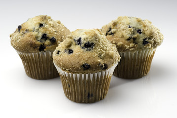 Three Blueberry Muffins Isolated on White