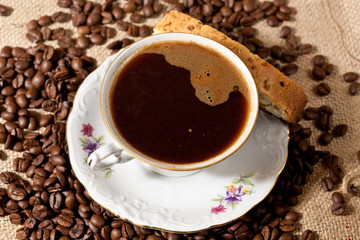Cup of coffee and biscotti cookie