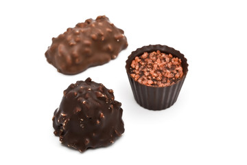Chocolates with nut on white background