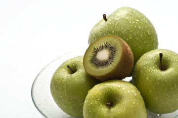 fruit composition: pile of green fruits on white background