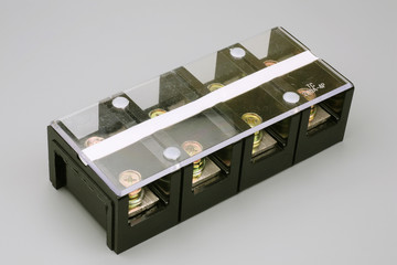 Terminal strip on a gray background - eight pins