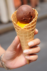 Icecream cone held by a woman