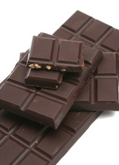 It is a lot of segments of chocolate on a white background