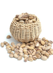It is a lot of nuts in a basket on a white background