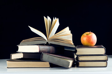 A red apple on a books