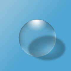Glass ball on blue background