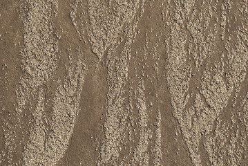 Sand pattern on ocean beach