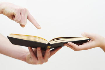 hands and book