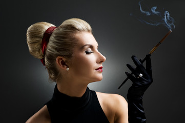 Beautiful smoking woman. Retro portrait