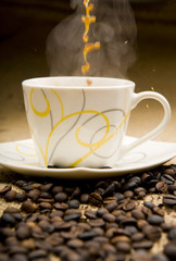 Pouring coffee and coffee-beans