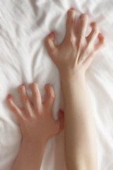 Womanish hands sinking in blanket #2