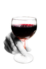 A hand holding a glass of red wine on white