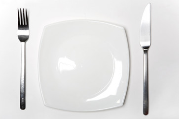 Fork, Knife and  White Plate on White Background