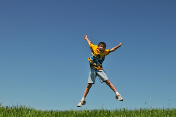 Fototapeta na wymiar Boy Jumping outdoors