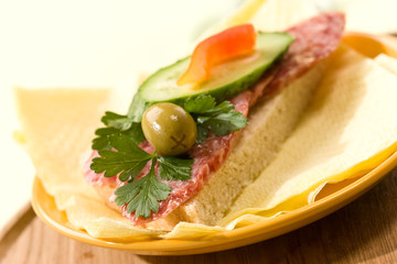 sandwich with salami, bread and butter