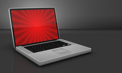 Glossy Steel Laptop on Gray Background with Burst Graphic on Scr