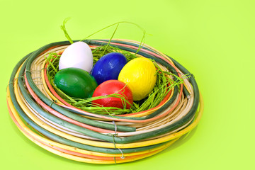 Colored eggs in the decor nest