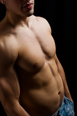 Artistic portrait of muscular male bodybuilder