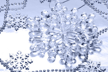 crystal snowflake on silver background