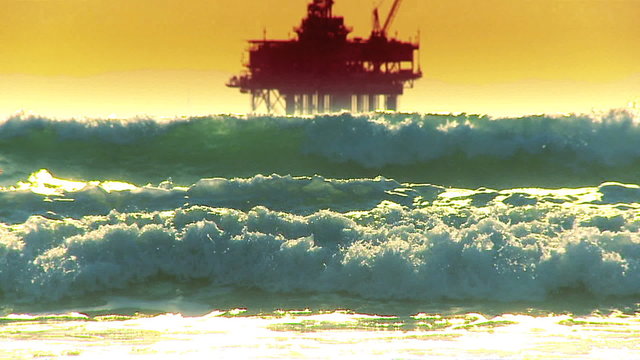 Oil Platforms At Sunset