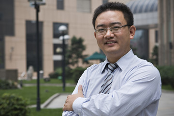 outdoor portrait of asian business executive