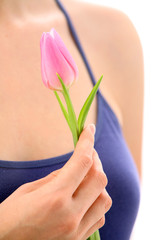 Beautiful hand holding tulip. Soft-focused.