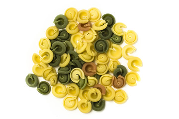Multi colored pasta on white background