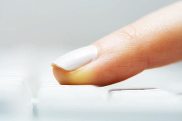 Female finger typing.