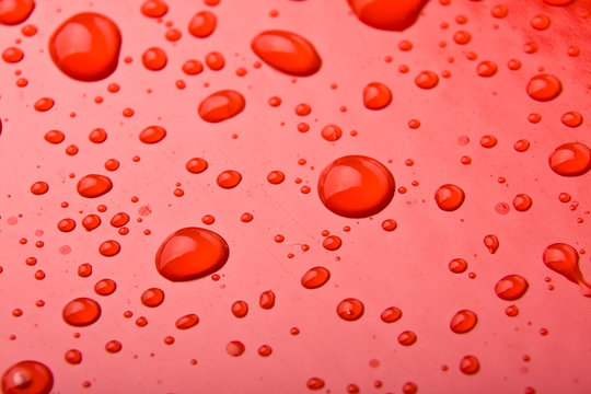 Water Drops on Red background