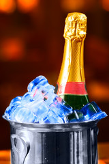 Champagne bottle in a bucket with an ice