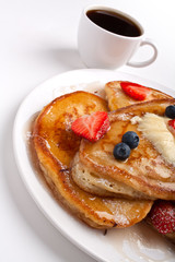 pancakes with melted butter, slathered with syrup and coffee